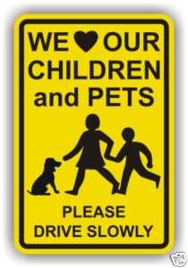 WE LOVE OUR CHILDREN & PETS   PLEASE DRIVE SLOW SIGN  