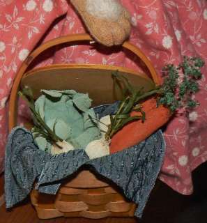   floral stems the vegetables are arranged atop a blue silky blend cloth