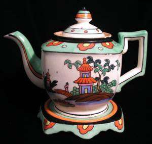 MADE IN JAPAN HANDPAINTED TEAPOT AND STAND  