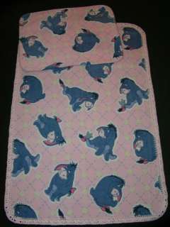 The theme of this fleece blanket   Eeyore and buttons on pretty pink