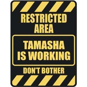   RESTRICTED AREA TAMASHA IS WORKING  PARKING SIGN