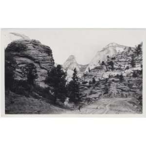  Reprint A view of striated canyon walls, mountains beyond 