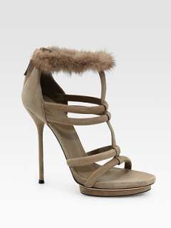   sliver of mink surrounds the ankle of this multi strap suede style