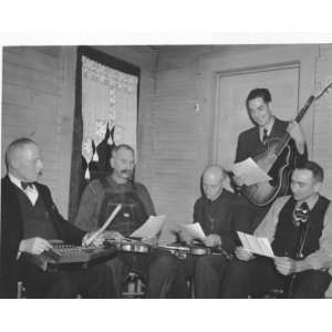 Bog Trotters Band members seated with instruments, Galax, Va. Includes 