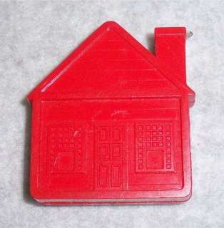   Red plastic house. Some minor scratches. Approximately 2 x 1.75