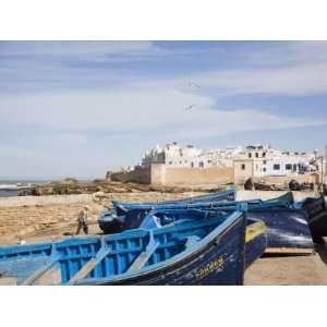 Small Wooden Fishing Boats on Seafront with White Buildings of the 